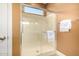 Bathroom featuring a glass shower with tiled walls and a chrome shower head at 13064 W Big Oak St, Peoria, AZ 85383