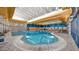 Indoor swimming pool with lap lanes and ample natural light at 13064 W Big Oak St, Peoria, AZ 85383