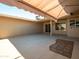 Expansive back patio featuring an awning, providing ample space for outdoor living and entertaining with a view of the yard at 13275 W Bolero Dr, Sun City West, AZ 85375