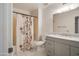 Bathroom showcasing a tub/shower combo and a granite vanity at 13275 W Bolero Dr, Sun City West, AZ 85375