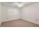 Inviting bedroom with shuttered window and overhead fan, offering a comfortable and well-lit space at 13275 W Bolero Dr, Sun City West, AZ 85375