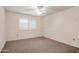 Comfortable bedroom with shuttered windows providing natural light and soft carpeting for a serene space at 13275 W Bolero Dr, Sun City West, AZ 85375
