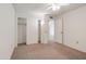 Well-lit bedroom with closet space featuring a plush carpet, overhead light, and ample closet space at 13275 W Bolero Dr, Sun City West, AZ 85375