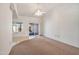 Bright, airy bedroom with neutral walls and carpet, complemented by a ceiling fan and a sliding glass door to the outside at 13275 W Bolero Dr, Sun City West, AZ 85375