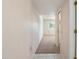 Hallway leading to a bedroom, featuring carpeted flooring and neutral walls at 13275 W Bolero Dr, Sun City West, AZ 85375