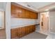 Office area features wood cabinets, countertop workspace, and neutral carpeting at 13275 W Bolero Dr, Sun City West, AZ 85375