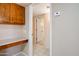 Office nook featuring a built-in desk and cabinets, located off the hallway at 13275 W Bolero Dr, Sun City West, AZ 85375