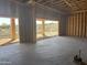 Three car garage under construction with open framing, cement floor, and bright natural light at 13515 N Granite Way, Fountain Hills, AZ 85268