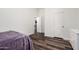 Well-lit bedroom with laminate floors offering ample space and storage at 1449 W Commerce Ave, Gilbert, AZ 85233