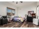 Fun bedroom with laminate floors, large window, and unique decor at 1449 W Commerce Ave, Gilbert, AZ 85233