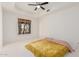 Bright bedroom featuring a ceiling fan and natural lighting at 1449 W Commerce Ave, Gilbert, AZ 85233