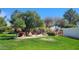 Beautifully landscaped community green space with mature trees and walking path at 1449 W Commerce Ave, Gilbert, AZ 85233