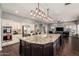 Spacious kitchen with a large center island, modern lighting, and stainless steel appliances at 1449 W Commerce Ave, Gilbert, AZ 85233