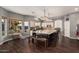 Open-concept kitchen features granite countertops, pendant lighting, and a large center island with seating at 1449 W Commerce Ave, Gilbert, AZ 85233