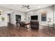 Spacious living room features a ceiling fan, hardwood floors, and comfortable seating at 1449 W Commerce Ave, Gilbert, AZ 85233
