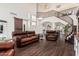 Bright and airy living room with high ceilings, hardwood floors, a staircase, and elegant chandelier at 1449 W Commerce Ave, Gilbert, AZ 85233