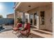 Charming outdoor patio with lounge chairs, offering a relaxing space by the pool at 1449 W Commerce Ave, Gilbert, AZ 85233