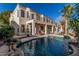 Backyard oasis with a sparkling pool, covered patio, and ample seating for entertaining at 1449 W Commerce Ave, Gilbert, AZ 85233