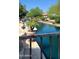 Idyllic canal featuring lush greenery, calm blue waters, and views of waterfront homes from a stone-lined patio at 1449 W Commerce Ave, Gilbert, AZ 85233