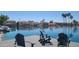 Relaxing waterfront view from a dock, featuring serene water, palm trees, and lakeside homes at 1449 W Commerce Ave, Gilbert, AZ 85233