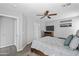 Bedroom with a ceiling fan, comfortable bed, and ample natural light at 1475 E Runaway Bay Dr, Chandler, AZ 85249