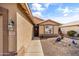 Well-maintained house featuring a front door, window, and low maintenance desert landscaping at 1475 E Runaway Bay Dr, Chandler, AZ 85249