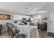 Spacious kitchen featuring stainless steel appliances, breakfast bar, and adjacent dining area at 1475 E Runaway Bay Dr, Chandler, AZ 85249