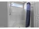 This is a well-maintained shower with a bench, adjustable shower head, and window at 1475 E Runaway Bay Dr, Chandler, AZ 85249