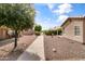 A view of the street showing the home and the surrounding landscaping at 1475 E Runaway Bay Dr, Chandler, AZ 85249