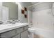 Clean bathroom with a tub-shower combo, vanity, and tile accents at 1552 E Shannon St, Chandler, AZ 85225