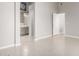 Spacious bedroom featuring neutral tones, tile flooring, and an ensuite bathroom entrance at 1552 E Shannon St, Chandler, AZ 85225