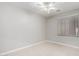 Cozy bedroom with tile flooring, a ceiling fan, and a bright window at 1552 E Shannon St, Chandler, AZ 85225