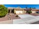 A beautifully landscaped home with a two-car garage, and desert-friendly accents at 1552 E Shannon St, Chandler, AZ 85225