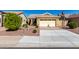 A well-maintained home with a two-car garage, tidy landscaping, and a paved driveway at 1552 E Shannon St, Chandler, AZ 85225
