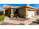 Charming single-story home featuring a two-car garage, desert landscaping, and a tidy walkway to the front door at 1552 E Shannon St, Chandler, AZ 85225