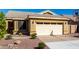 Charming single-story home with a two-car garage and low maintenance desert landscaping in front at 1552 E Shannon St, Chandler, AZ 85225
