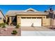 Home featuring a two-car garage, desert landscaping, and a paved driveway at 1552 E Shannon St, Chandler, AZ 85225