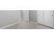 Neutral hallway featuring tile flooring, fresh paint, and a linen closet at 1552 E Shannon St, Chandler, AZ 85225