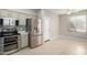 Cozy kitchen featuring stainless steel appliances and cabinets with a view into a dining area at 1552 E Shannon St, Chandler, AZ 85225