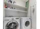 Well-equipped laundry room with modern washer and dryer units and shelving at 1552 E Shannon St, Chandler, AZ 85225