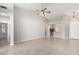 Spacious living room with tile flooring, high ceilings, and an open layout to the kitchen and dining areas at 1552 E Shannon St, Chandler, AZ 85225