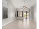 Bright and open living room with tile floors, large windows, and a ceiling fan, perfect for entertaining at 1552 E Shannon St, Chandler, AZ 85225