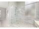 Modern bathroom featuring a glass-enclosed shower with marble tile surround and hexagon tile flooring at 1552 E Shannon St, Chandler, AZ 85225