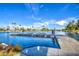Beautiful lake view showcasing a wooden dock, palm trees, and clear blue skies, creating a tranquil waterfront atmosphere at 1942 S Emerson -- # 127, Mesa, AZ 85210