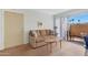 A cozy living room with a sliding glass door provides ample natural light and access to outdoor space at 1942 S Emerson -- # 127, Mesa, AZ 85210