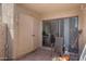 Enclosed patio showing tile flooring, textured walls, furniture, and sliding glass door leading into the home at 1942 S Emerson -- # 127, Mesa, AZ 85210