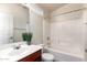 Bright bathroom with a modern vanity, stylish fixtures, and a clean, white shower-tub combination at 2024 S Baldwin St # 161, Mesa, AZ 85209