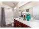 Bright bathroom features white cabinets, a shower and tub combination, and elegant accents at 2024 S Baldwin St # 161, Mesa, AZ 85209