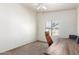 Inviting bedroom with natural light, carpet, and a ceiling fan makes for a comfortable and versatile space at 2024 S Baldwin St # 161, Mesa, AZ 85209