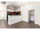 Dining area with bar top and kitchen access plus washer and dryer room at 2024 S Baldwin St # 161, Mesa, AZ 85209